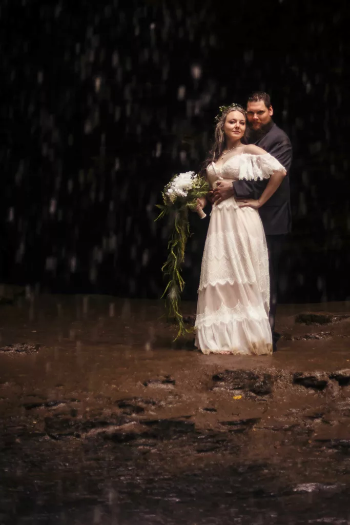 bride & groom in the pisgah national forest near asheville, under a waterfall