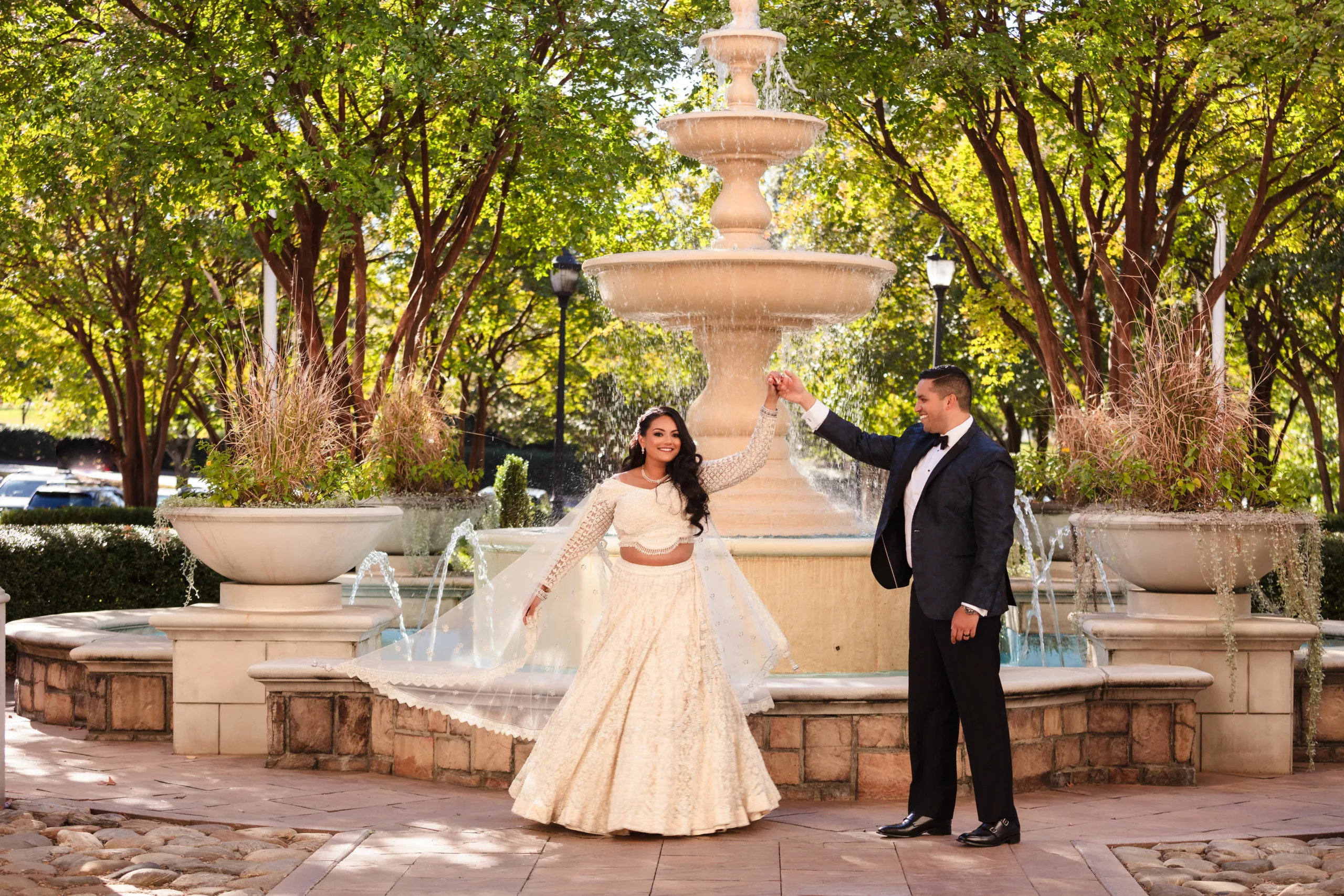Indian bride and groom in Charlotte, NC, twirling and laughing.